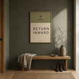 Return Inward print in an oak frame on a sage hallway wall above a bench, shown in 50x70cm