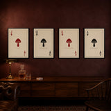 The full Spore Deck, all four prints framed in black and hung in a row on an oxblood wall: Jack, Queen, King, Ace